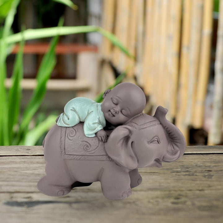 Zen'Light Statue Buddha Bonze Sleeping on Elephant - Atmosferă Zen în spațiul tău sacru - frumoasă figură de bun augur -H 9.5 cm, Brown & Green Statuete si sculpturi Naty Shop